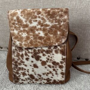 Brown and White cow print hair leather backpack 
New